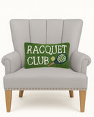 Racquet Club Hooked Wool Throw Pillow on an armchair, showing the throw pillow at room scale, 9x16 inch