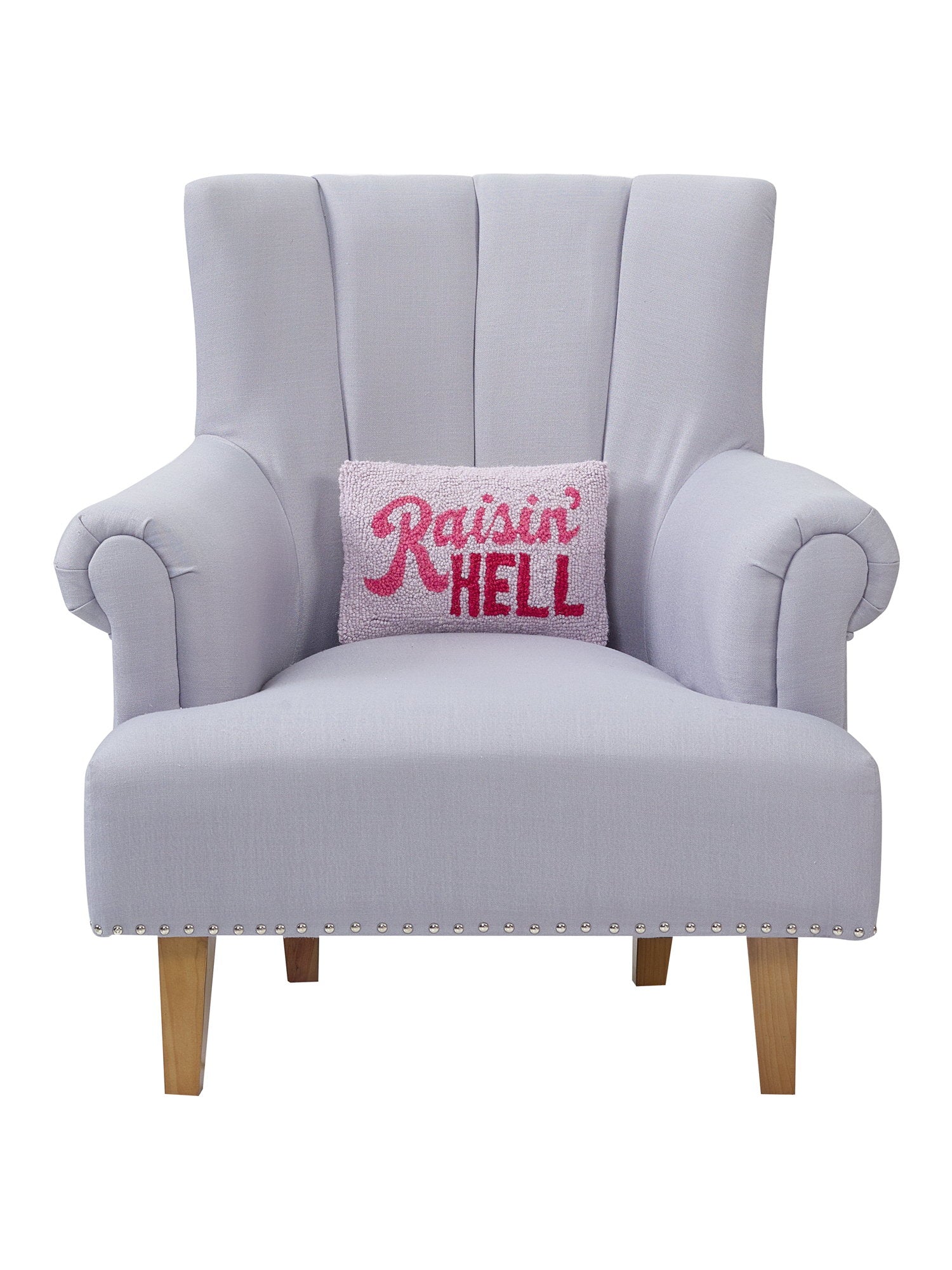 Raisin' Hell Hooked Wool Throw Pillow on an armchair, showing the throw pillow at room scale, 8x12 inch