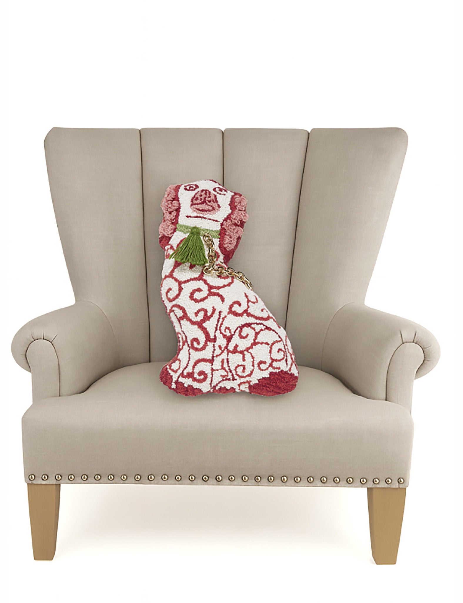 Red Dog with Tassel Chain Hooked Wool Christmas Throw Pillow on an armchair, showing the throw pillow at room scale, 12x18 inch