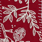 Closeup of Red Folk Branch Embroidered Christmas Stocking showing stitch texture and craftsmanship detail