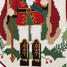 Closeup of Red Holly Nutcracker Embroidered Needlepoint Christmas Stocking showing stitch texture and craftsmanship detail