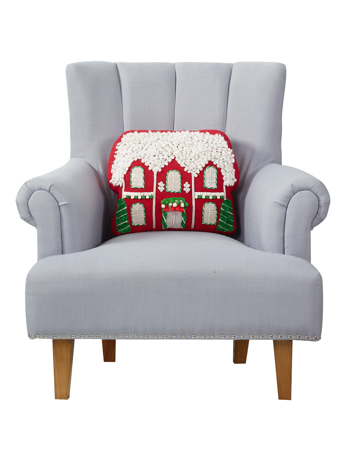 Red House Applique with Poms Embroidered Christmas Throw Pillow on an armchair, showing the throw pillow at room scale, 12x16 inch