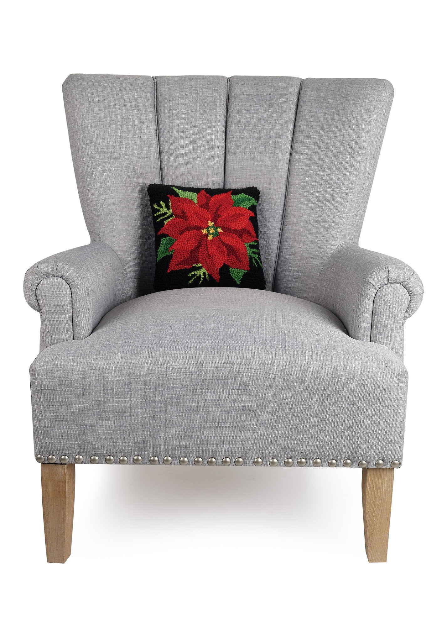 Red on Black Poinsettia Hooked Wool Christmas Throw Pillow on an armchair, showing the throw pillow at room scale, 10x10 inch
