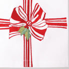 Closeup of Red Ribbon Christmas Kitchen Towel showing print and fabric detail