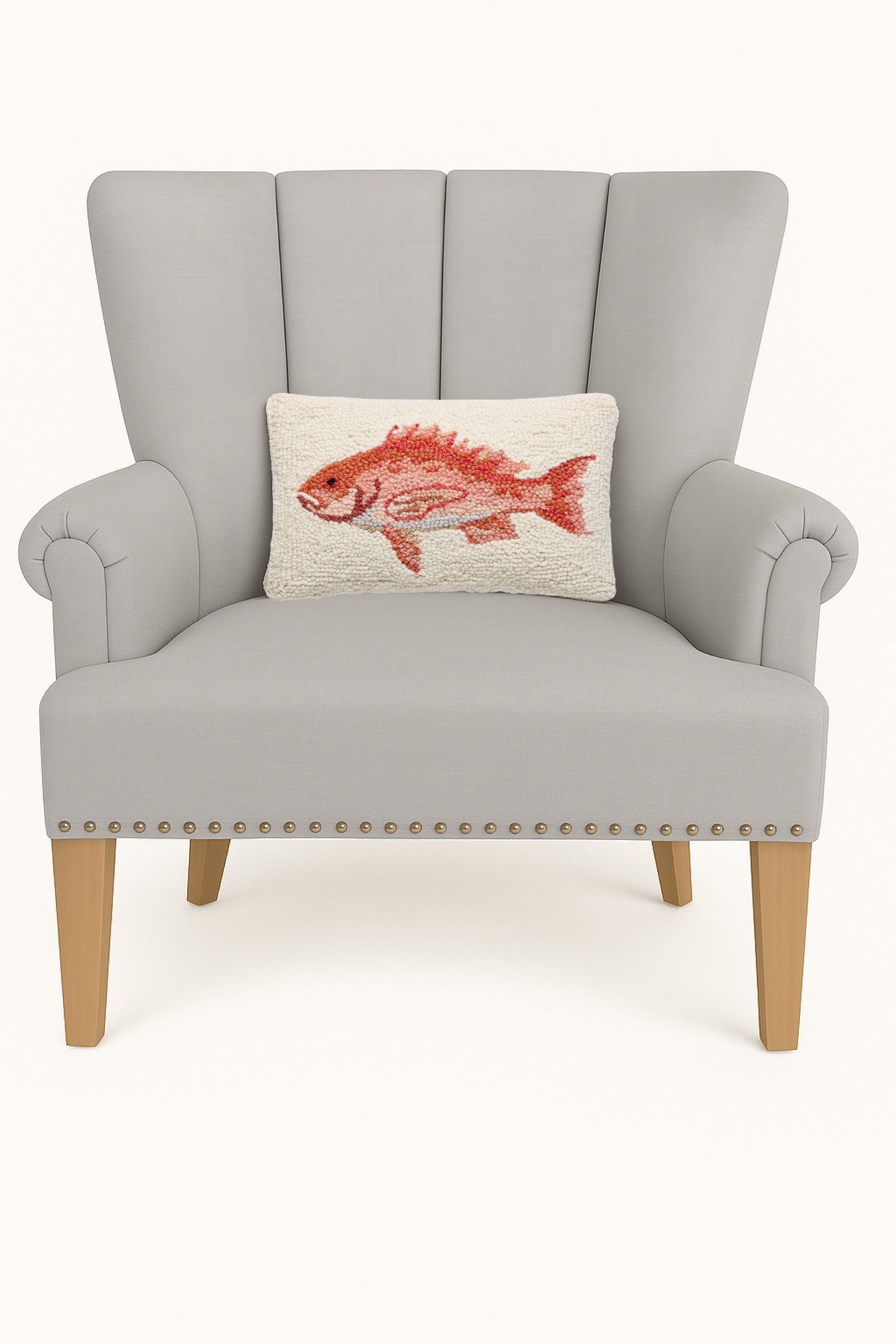 Red Snapper Hooked Wool Throw Pillow on an armchair, showing the throw pillow at room scale, 8x12 inch