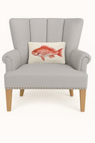 Red Snapper Hooked Wool Throw Pillow on an armchair, showing the throw pillow at room scale, 8x12 inch