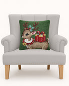 Reindeer with Present Hooked Wool Christmas Throw Pillow on an armchair, showing the throw pillow at room scale, 16x16 inch