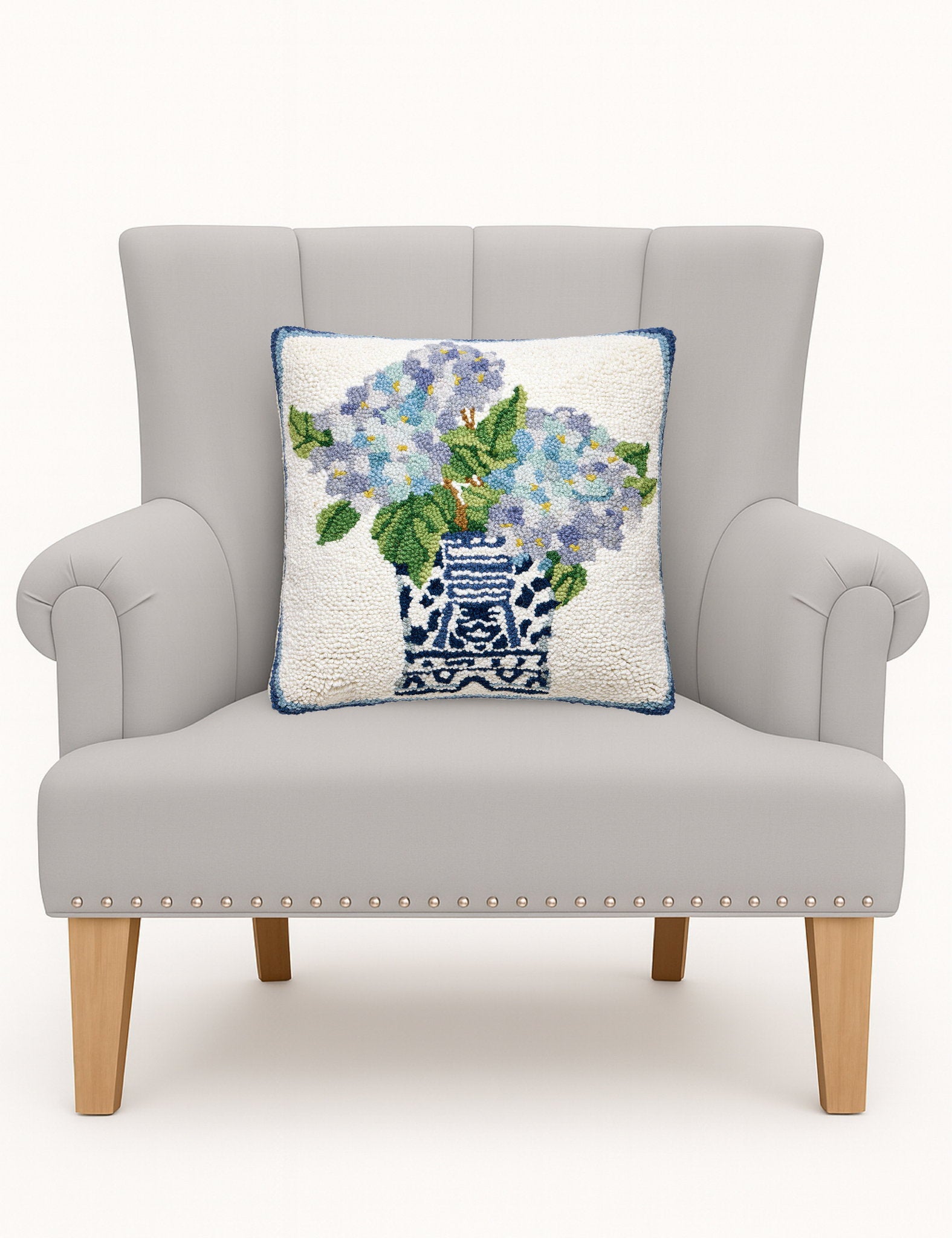 Rhapsody in Blue I Hooked Wool Throw Pillow on an armchair, showing the throw pillow at room scale, 16x16 inch