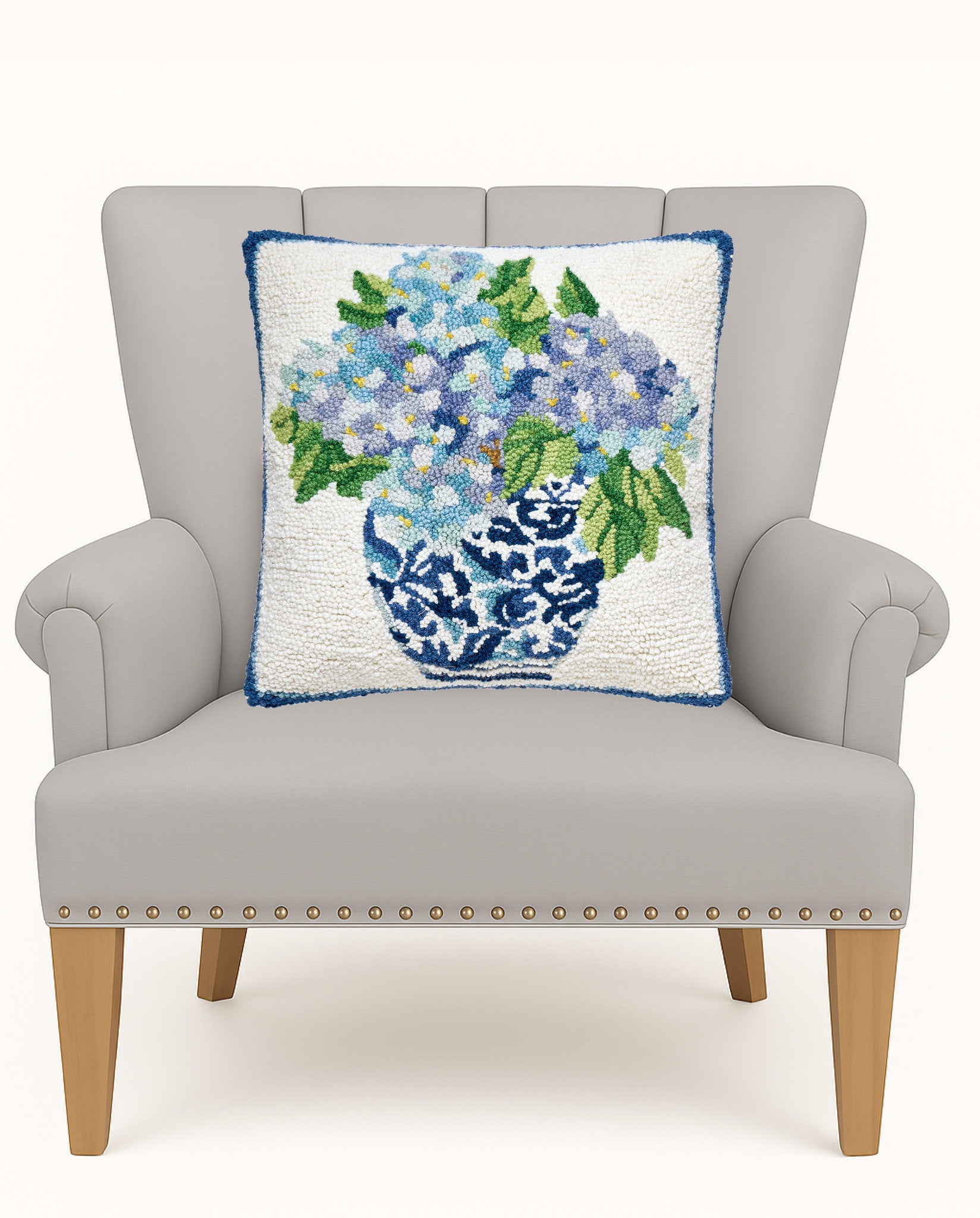 Rhapsody in Blue II Hooked Wool Throw Pillow on an armchair, showing the throw pillow at room scale, 16x16 inch