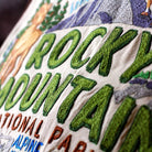 Rocky Mountain Alpine Glory National Park Embroidered Pillow - close-up detail of hand-embroidered needlepoint stitching