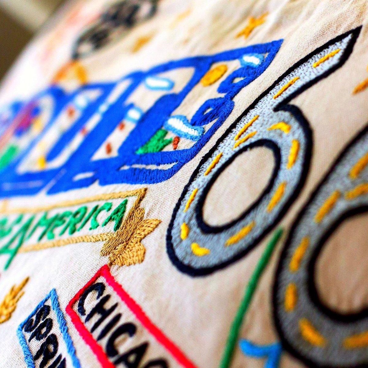 Route 66 Historic Road Embroidered Throw Pillow - close-up detail of hand-embroidered needlepoint stitching