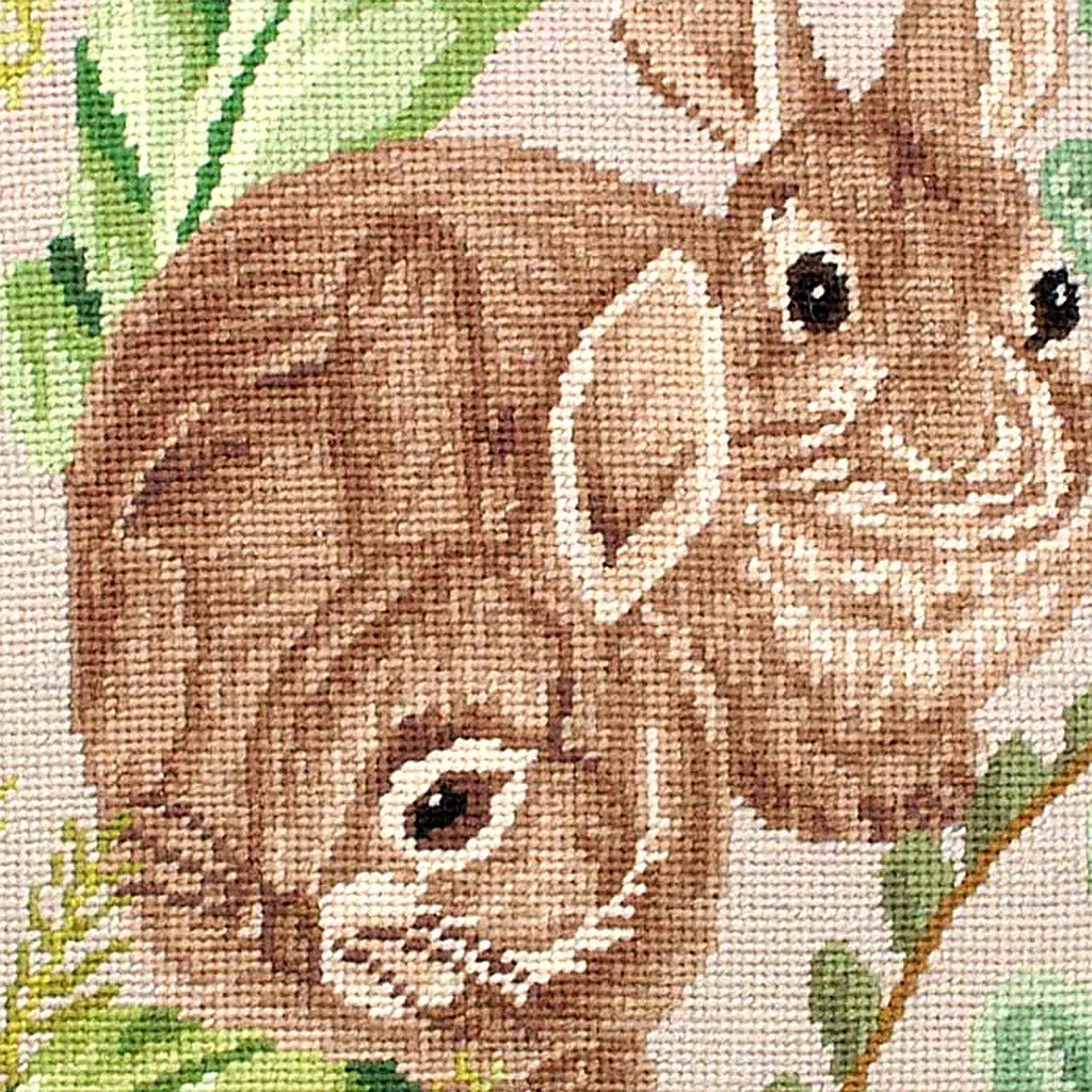 Hand-stitched wool detail of Rustic Playing Rabbits Wildlife needlepoint pillow showing intricate weave pattern and texture