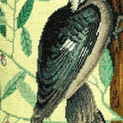 Closeup of Rustic Red Crested Woodpecker Wildlife Embroidered needlepoint throw pillow highlighting hand-stitched wool craftsmanship and fabric detail