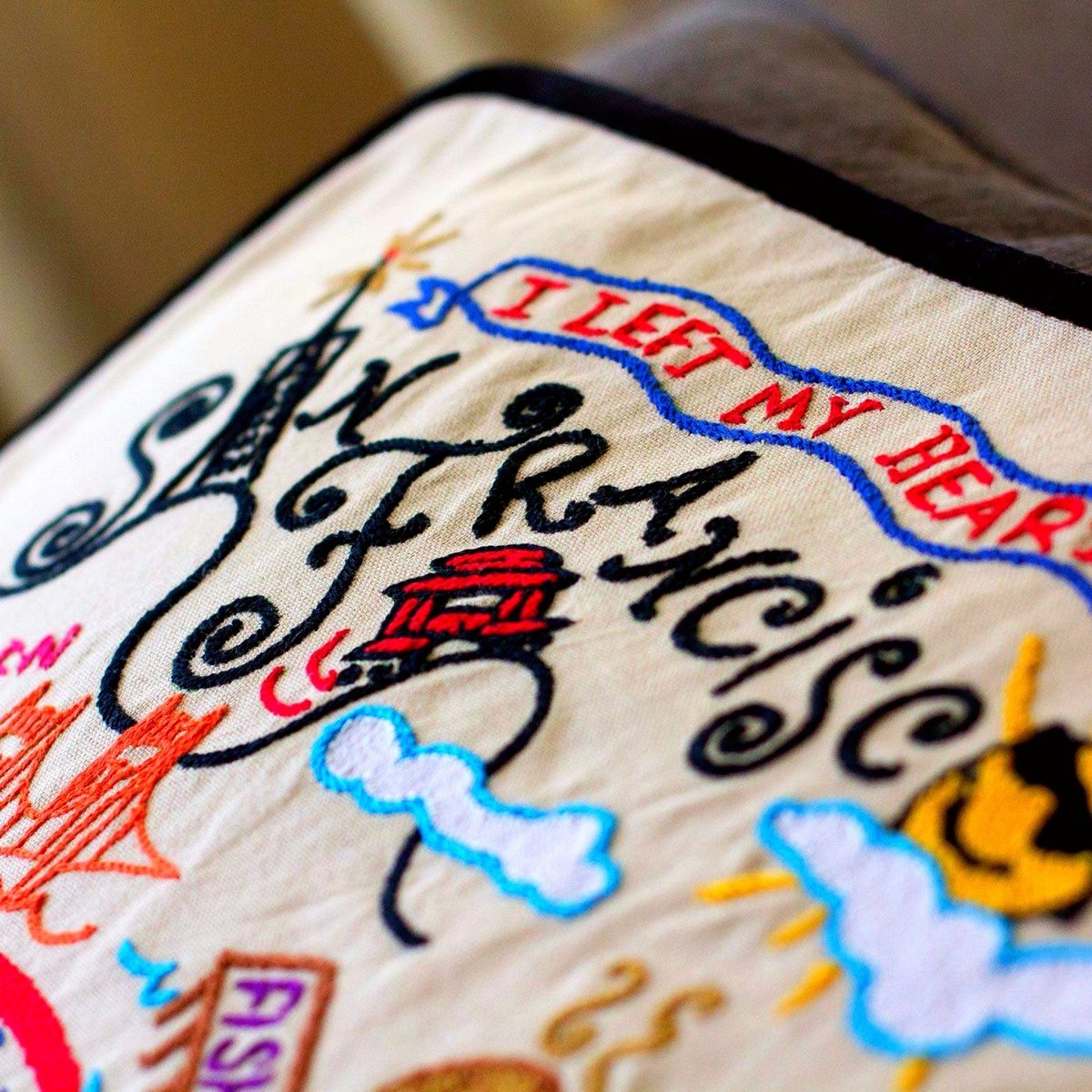 San Francisco, CA Golden Gate Embroidered Travel Pillow - close-up detail of hand-embroidered needlepoint stitching