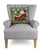 Santa Sleigh Hooked Wool Christmas Throw Pillow on an armchair, showing the throw pillow at room scale, 18x18 inch