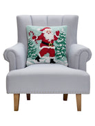 Santa with Candy Cane Hooked Wool Christmas Throw Pillow on an armchair, showing the throw pillow at room scale, 18x18 inch