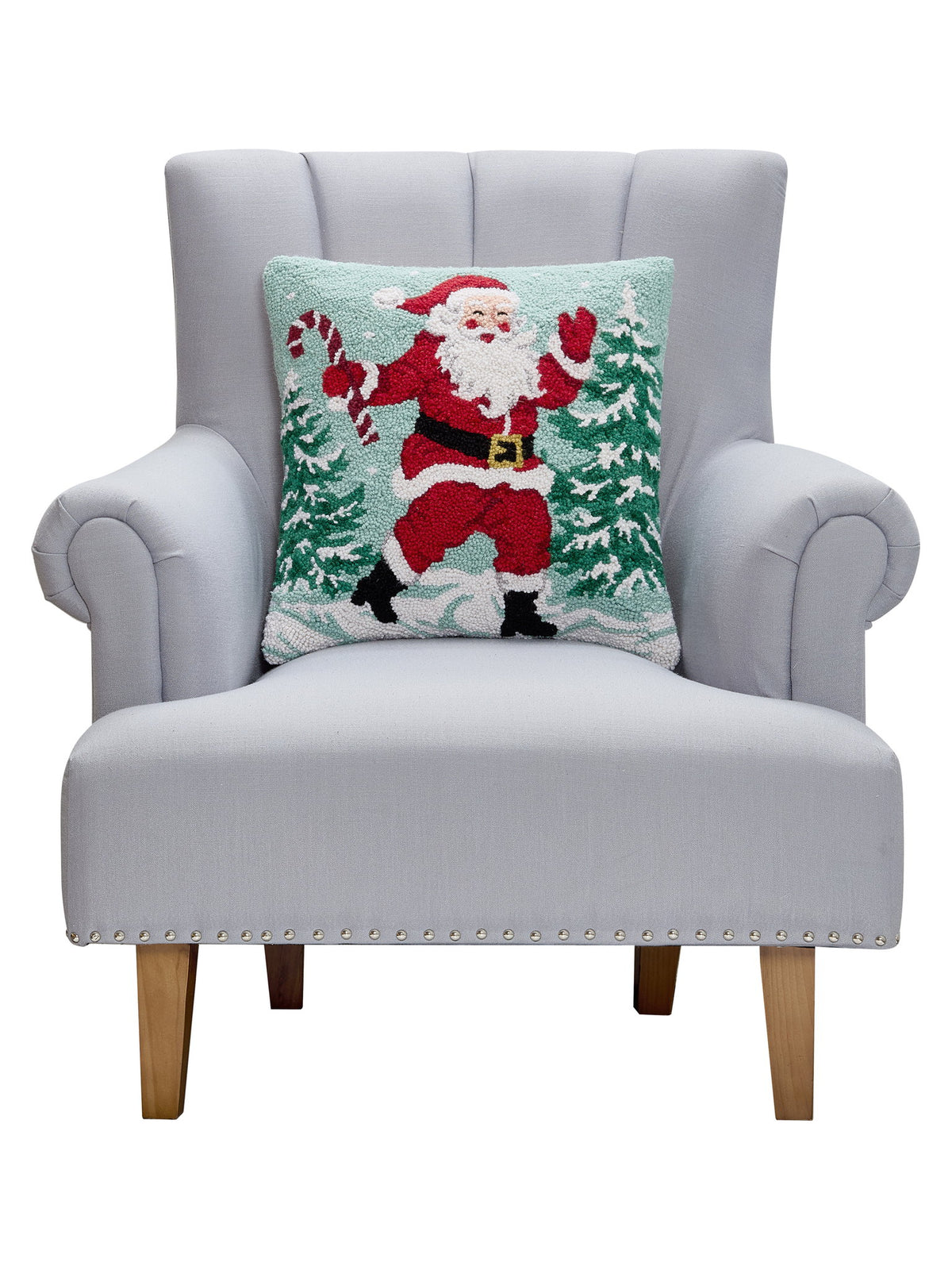 Santa with Candy Cane Hooked Wool Christmas Throw Pillow on an armchair, showing the throw pillow at room scale, 18x18 inch