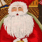 Hand-stitched wool detail of Santa with Gifts Wool Needlepoint Holiday needlepoint pillow showing intricate weave pattern and texture