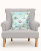 Scattered Sprigs Blue Spring Mughal Embroidered Throw Pillow on an armchair, showing the throw pillow at room scale, 16x16 inch
