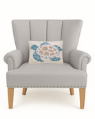 Sea Turtle Hooked Wool Throw Pillow on an armchair, showing the throw pillow at room scale, 8x12 inch