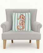 Seahorse Hooked Wool Throw Pillow on an armchair, showing the throw pillow at room scale, 16x16 inch
