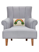 Shamrock Rainbow Hooked Wool St. Patrick's Day Throw Pillow on an armchair, showing the throw pillow at room scale, 8x12 inch