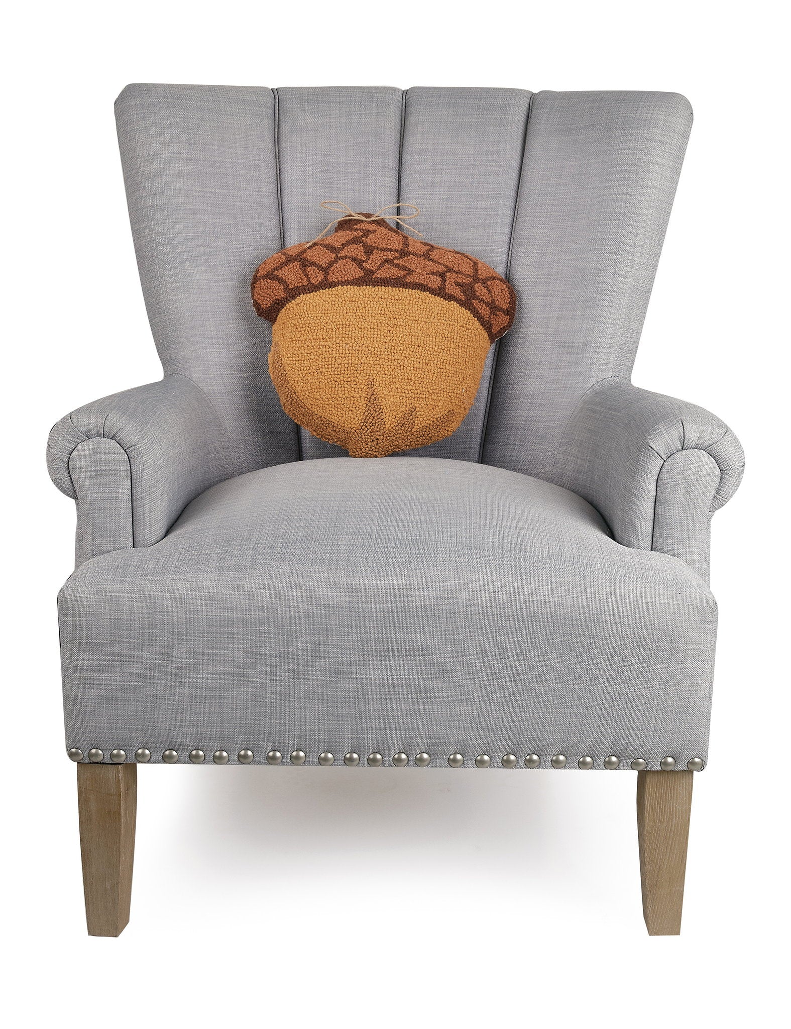 Shaped Acorn Hooked Wool Fall Harvest Throw Pillow on an armchair, showing the throw pillow at room scale, 14x14 inch