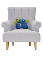Shaped Blueberries Hooked Wool Throw Pillow on an armchair, showing the throw pillow at room scale, 12x16 inch