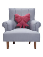Shaped Bow Hooked Wool Throw Pillow on an armchair, showing the throw pillow at room scale, 16x16 inch