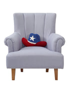 Shaped Cowboy Patriotic Hat Hooked Wool Throw Pillow on an armchair, showing the throw pillow at room scale, 9x16 inch