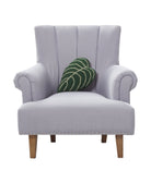 Shaped Elephant Ear Leaf Hooked Wool Throw Pillow on an armchair, showing the throw pillow at room scale, 9x16 inch