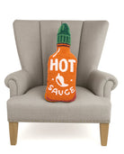 Shaped Hot Sauce Hooked Wool Throw Pillow on an armchair, showing the throw pillow at room scale, 8x20 inch