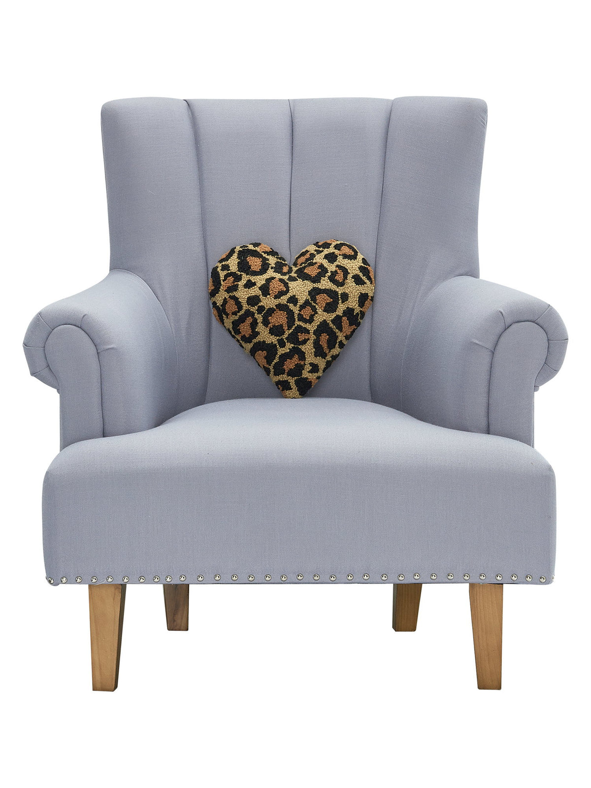 Shaped Leopard Heart Hooked Wool Throw Pillow on an armchair, showing the throw pillow at room scale, 12x12 inch