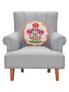 Shaped Mughal Flower Hooked Wool Throw Pillow on an armchair, showing the throw pillow at room scale, 16x16 inch