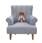 Shaped Nutcracker Hooked Wool Christmas Throw Pillow on an armchair, showing the throw pillow at room scale, 8x12 inch