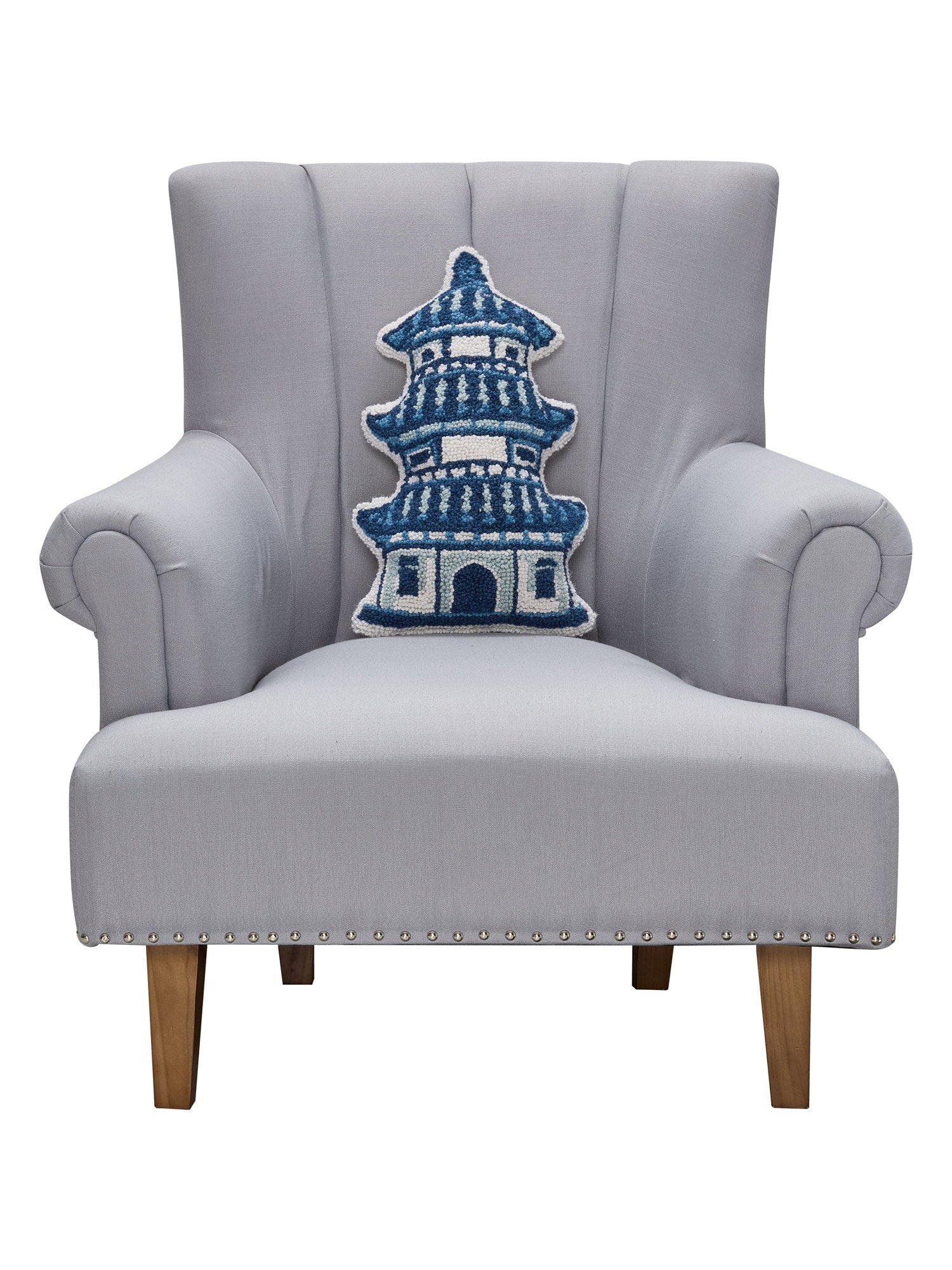 Shaped Pagoda Hooked Wool Throw Pillow on an armchair, showing the throw pillow at room scale, 12x18 inch