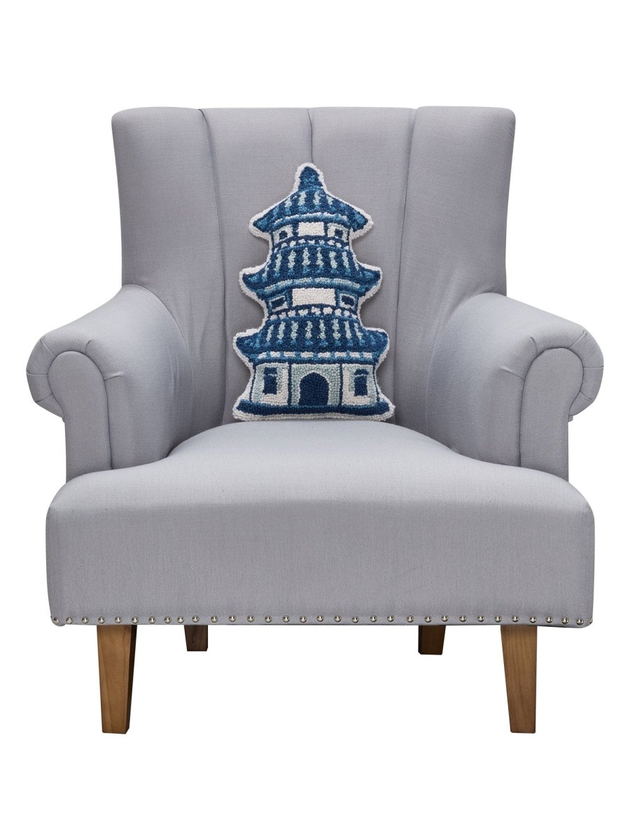 Shaped Pagoda Hooked Wool Throw Pillow on an armchair, showing the throw pillow at room scale, 12x18 inch