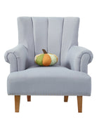 Shaped Patchwork Pumpkin Embroidered Fall Harvest Throw Pillow on an armchair, showing the throw pillow at room scale, 9x9 inch