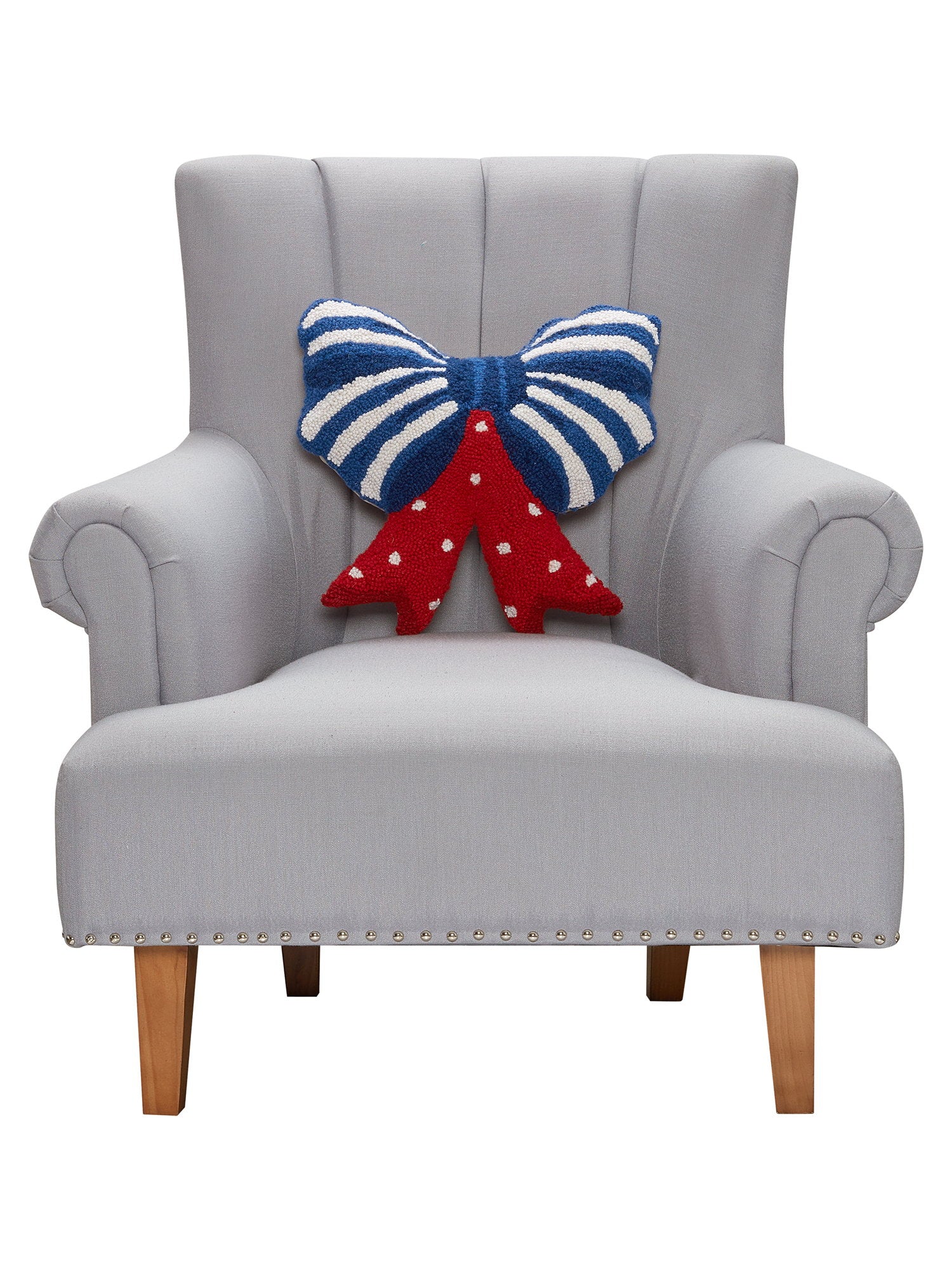 Shaped Patriotic Bow Hooked Wool Throw Pillow on an armchair, showing the throw pillow at room scale, 16x16 inch
