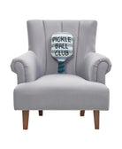 Shaped Pickle Ball Paddle Hooked Wool Throw Pillow on an armchair, showing the throw pillow at room scale, 9x18 inch