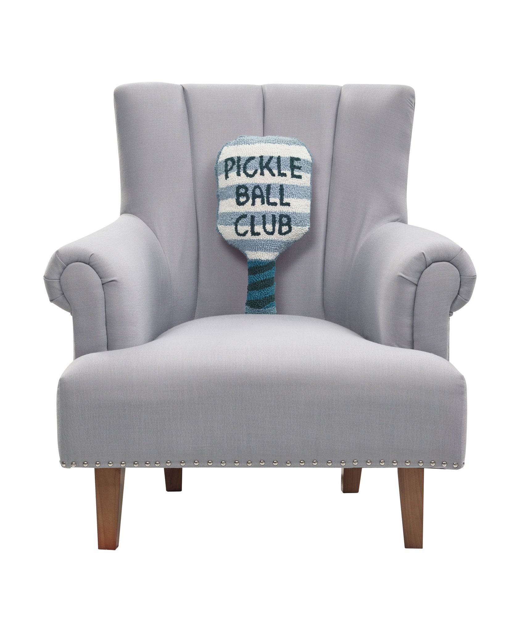 Shaped Pickle Ball Paddle Hooked Wool Throw Pillow on an armchair, showing the throw pillow at room scale, 9x18 inch