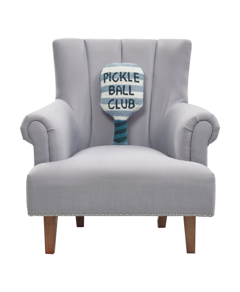 Shaped Pickle Ball Paddle Hooked Wool Throw Pillow on an armchair, showing the throw pillow at room scale, 9x18 inch