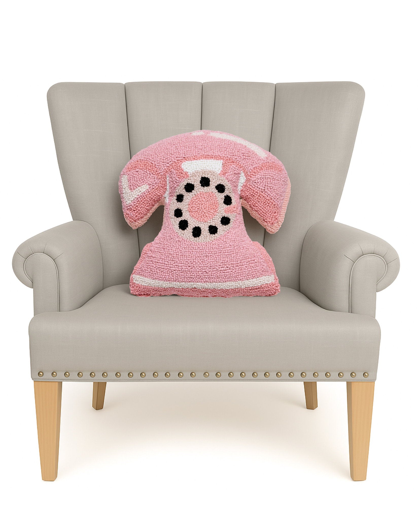 Shaped Pink Telephone Hooked Wool Throw Pillow on an armchair, showing the throw pillow at room scale, 14x16 inch