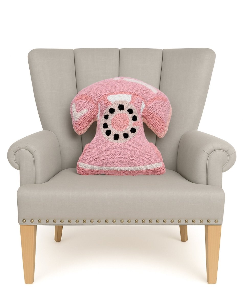 Shaped Pink Telephone Hooked Wool Throw Pillow on an armchair, showing the throw pillow at room scale, 14x16 inch