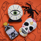 Shaped Poison Bottle Hooked Wool Halloween Throw Pillow shown alongside other designs in the same collection, 9x16 inch