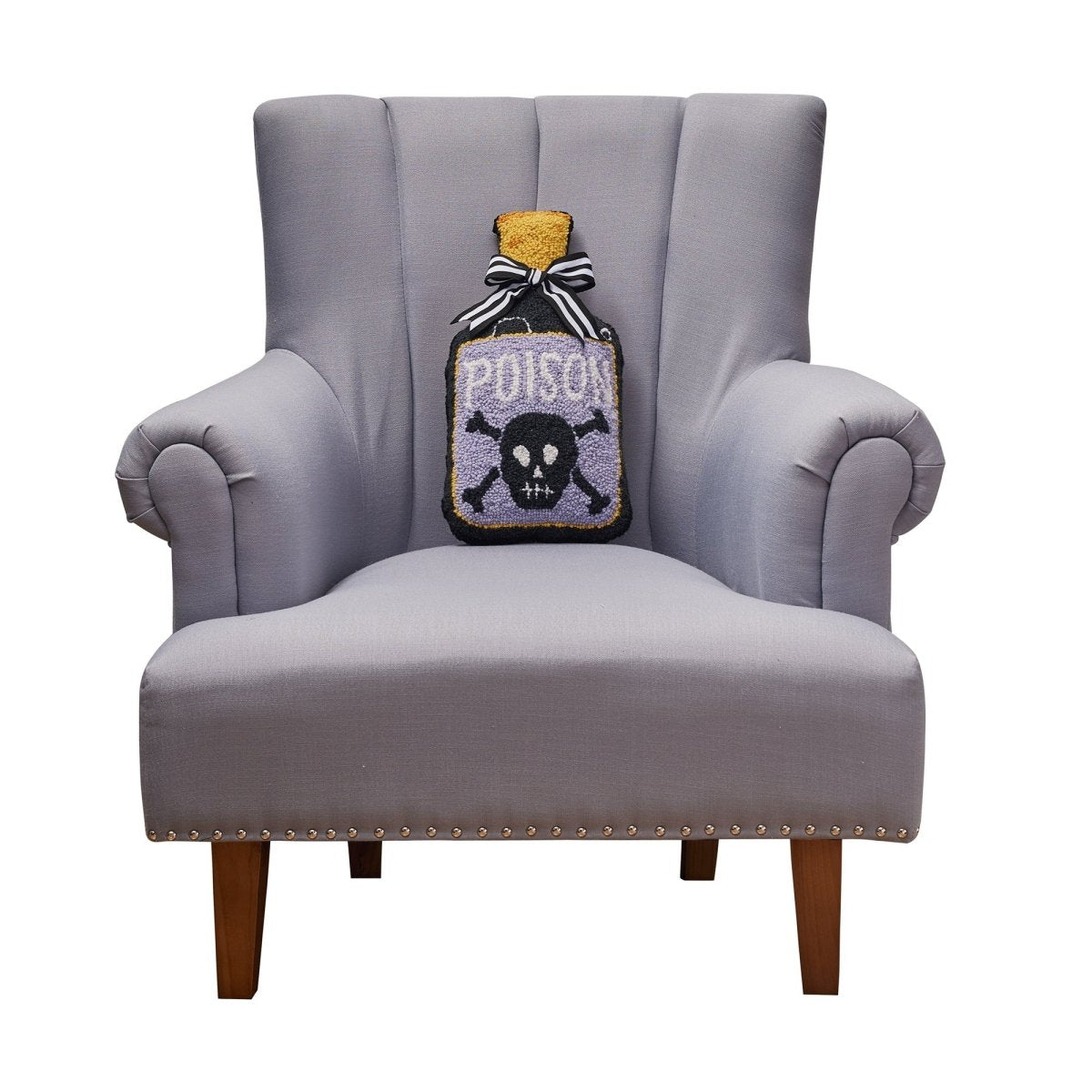 Shaped Poison Bottle Hooked Wool Halloween Throw Pillow on an armchair, showing the throw pillow at room scale, 9x16 inch