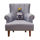 Shaped Poison Bottle Hooked Wool Halloween Throw Pillow on an armchair, showing the throw pillow at room scale, 9x16 inch