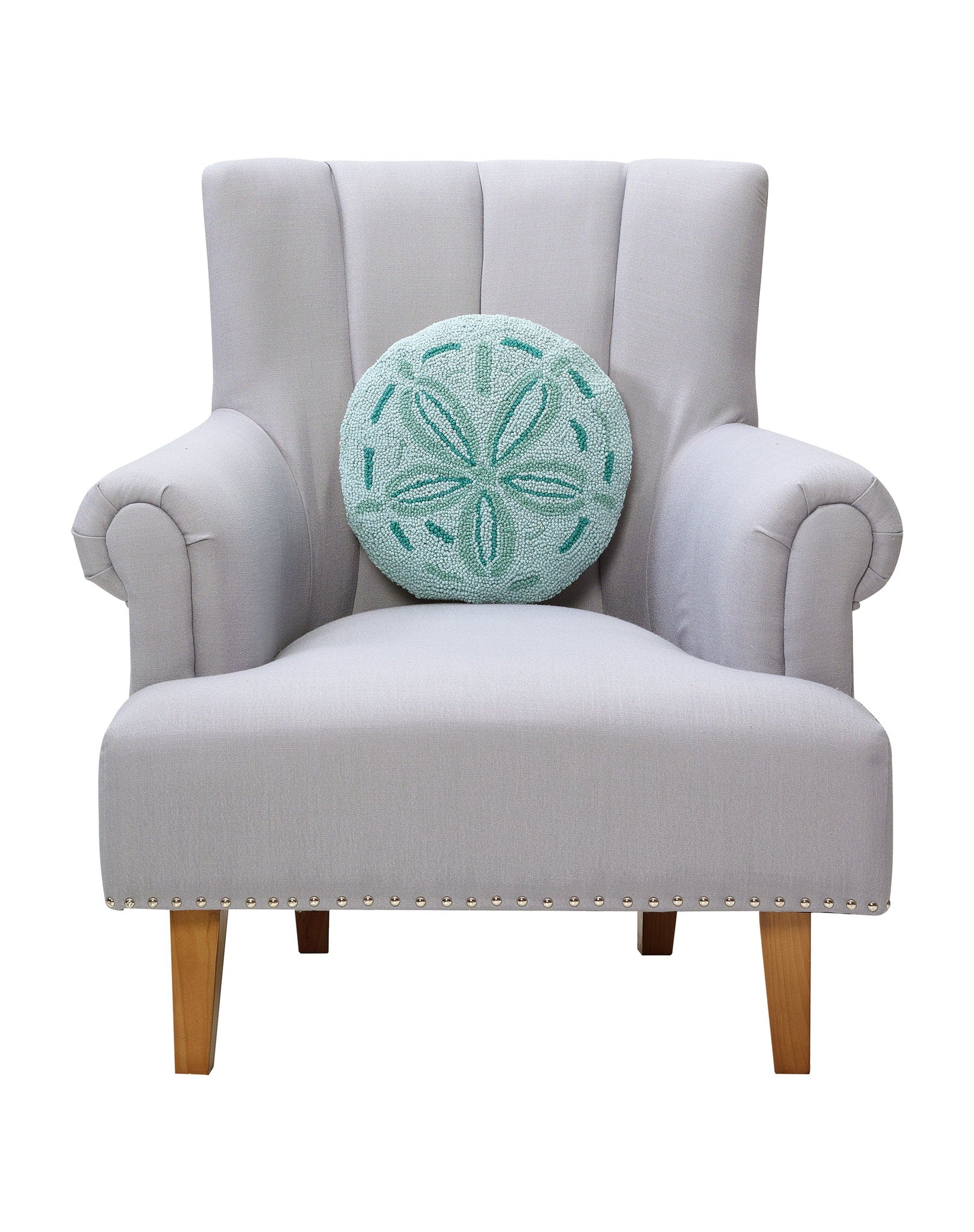 Shaped Sand Dollar Hooked Wool Throw Pillow on an armchair, showing the throw pillow at room scale, 14x14 inch