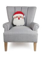 Shaped Santa Face Hooked Wool Christmas Throw Pillow on an armchair, showing the throw pillow at room scale, 12x16 inch