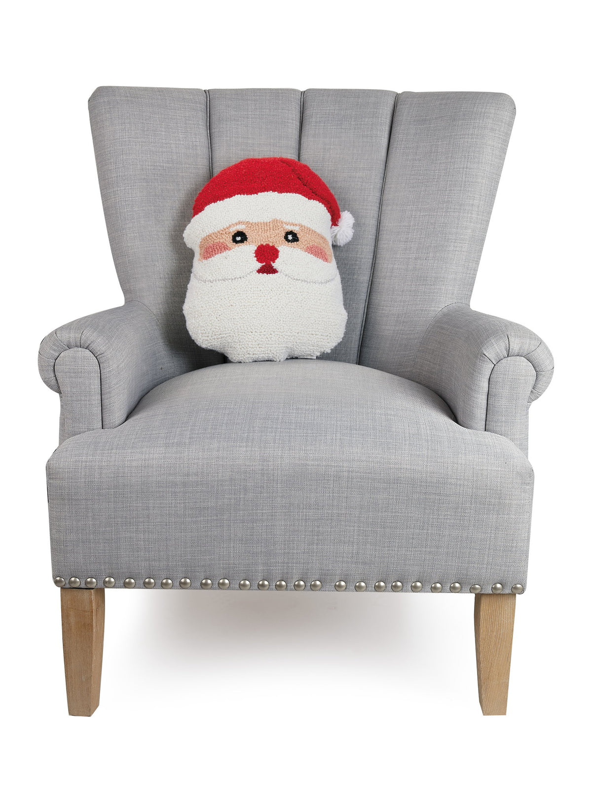 Shaped Santa Face Hooked Wool Christmas Throw Pillow on an armchair, showing the throw pillow at room scale, 12x16 inch